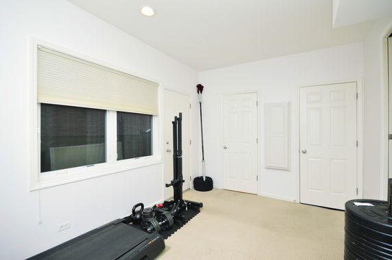 Indoor room with exercise equipment and closed doors