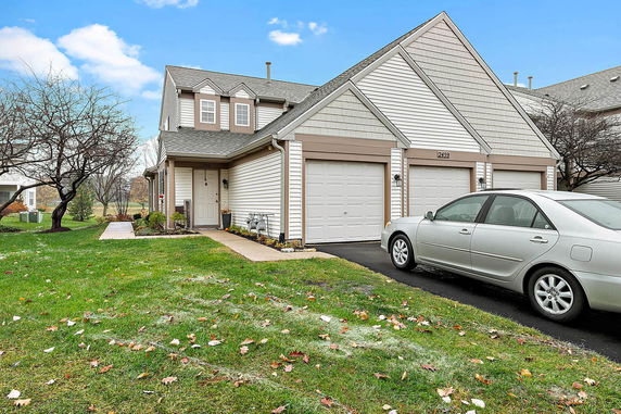 Front view of a two-story house with a double garage.