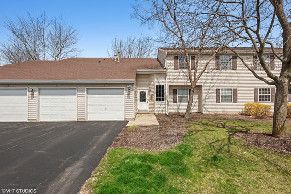 Front view of a house with a three-car garage.