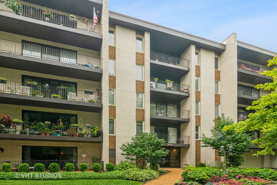 Front view of a multi-story residential building with balconies.