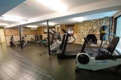 Indoor gym area with exercise equipment.