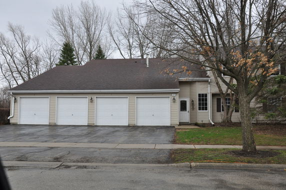 Front view of a house with a three-car garage.