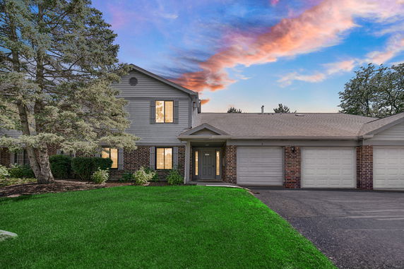 Front view of a two-story house with a double garage.