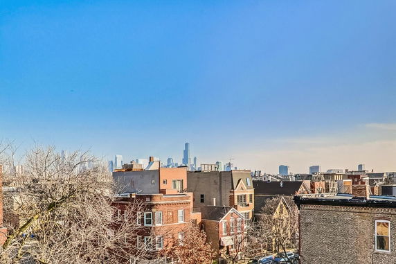 Panoramic view of cityscape with buildings and skyscrapers in the background.