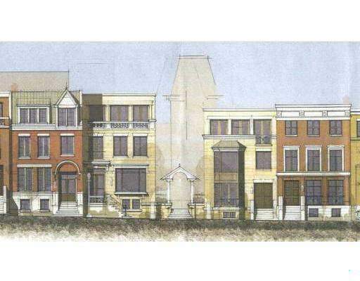 Front view of a row of townhouses with brick facades and multiple stories.