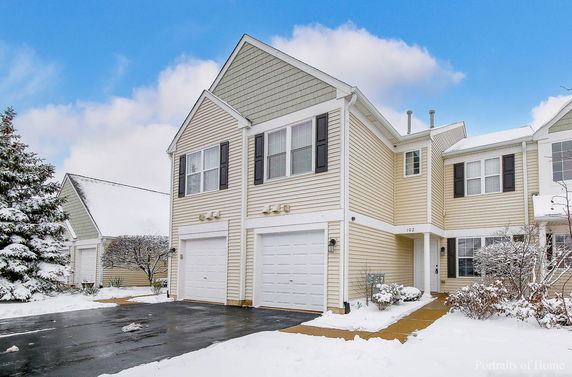 Front view of a two-story house with a double garage.
