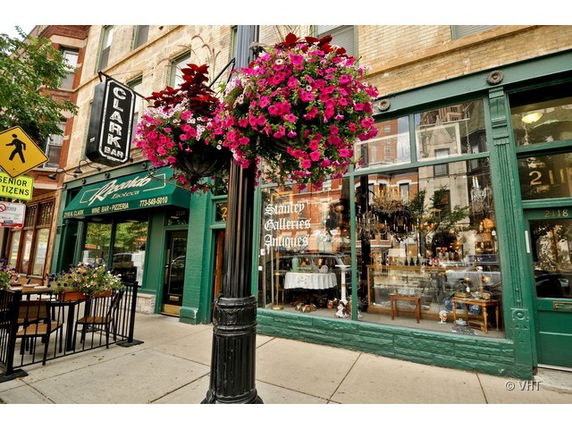 Front view of a building with a bar and antique shop.