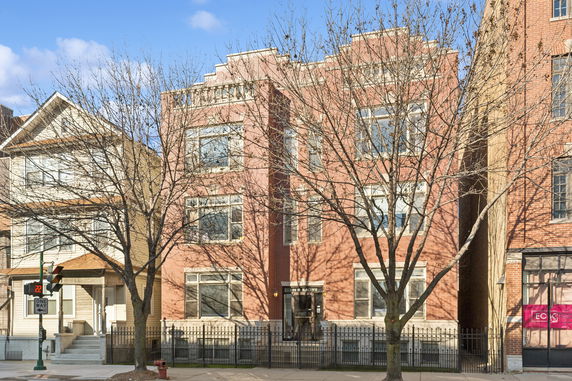 Front view of a multi-story brick building.