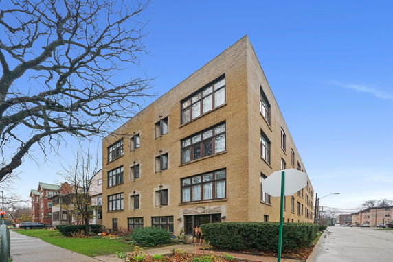 Front view of a multi-story brick building.