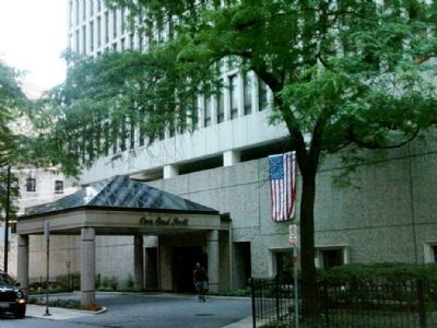 Front view of a multi-story building with a covered entrance.