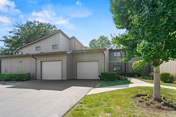 Front view of a two-story house with double garage.