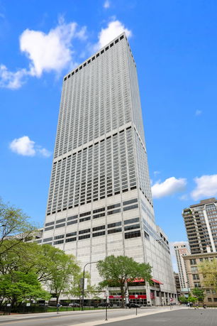 Front view of a tall skyscraper building.