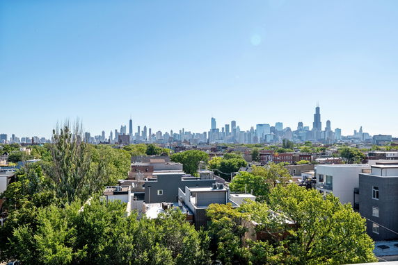 Panoramic cityscape view with skyline in the distance.