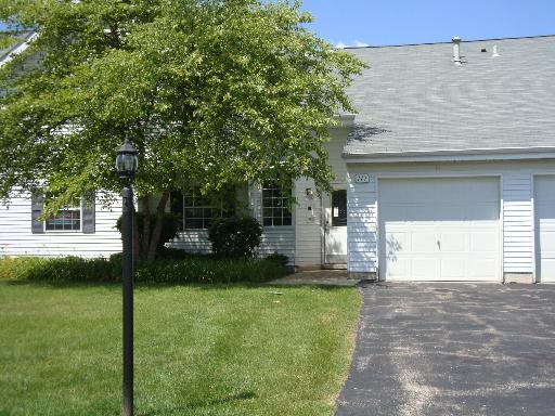 Front view of a single-story house with attached garage.