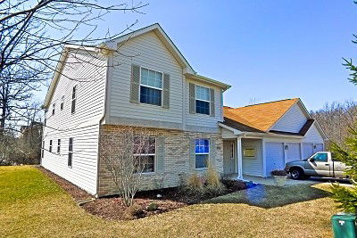 Front view of a two-story house with attached garage.