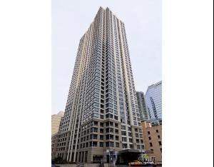 Front view of a tall multi-story building.