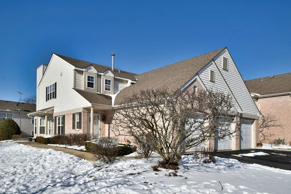 Front view of a two-story house with a double garage.