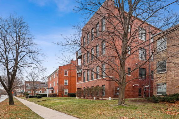 Front view of a multi-story brick building.
