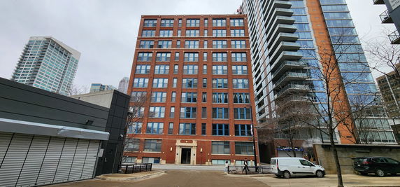 Front view of a multi-story brick building.