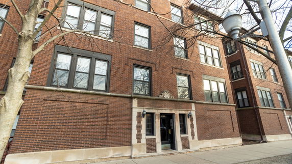 Front view of a multi-story brick apartment building