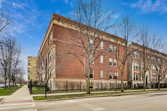 Front view of a multi-story brick building.