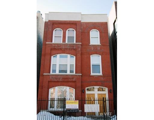 Front view of a three-story brick building.