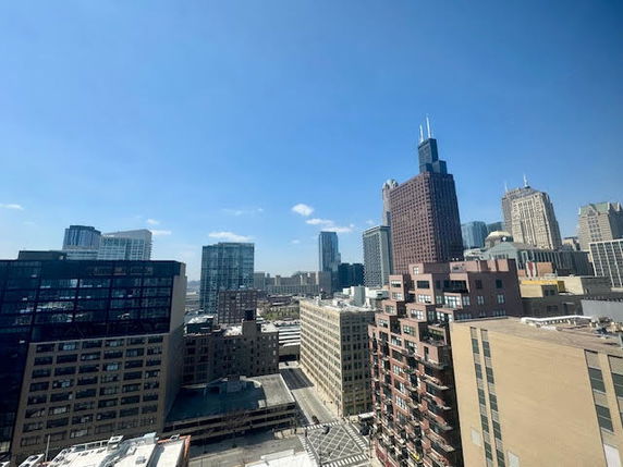 Panoramic view of a city skyline with multiple tall buildings.