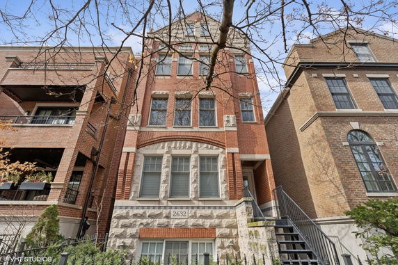 Front view of a three-story brick building.