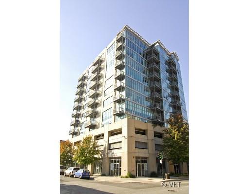 Front view of a multi-story building with numerous balconies.