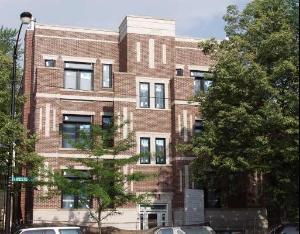 Front view of a multi-story brick residential building.