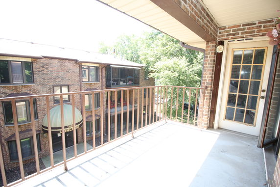 Balcony view of a building complex with brick exteriors.
