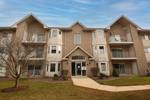 Front view of a multi-story apartment building.