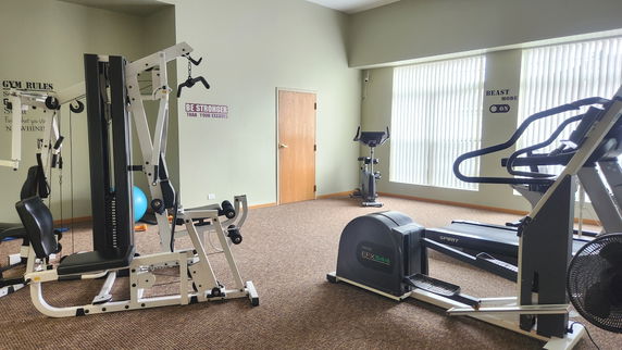 Indoor gym with exercise machines and fitness equipment