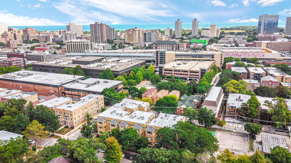 Panoramic view of an urban area with various buildings and distant skyline.