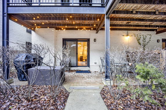 Front view of a house with a covered patio area.