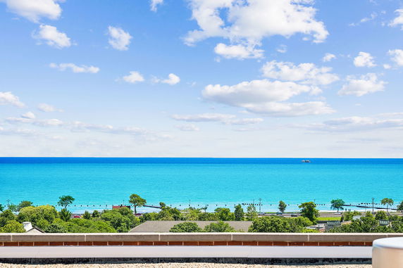Panoramic view of the ocean and coastline from a high vantage point.