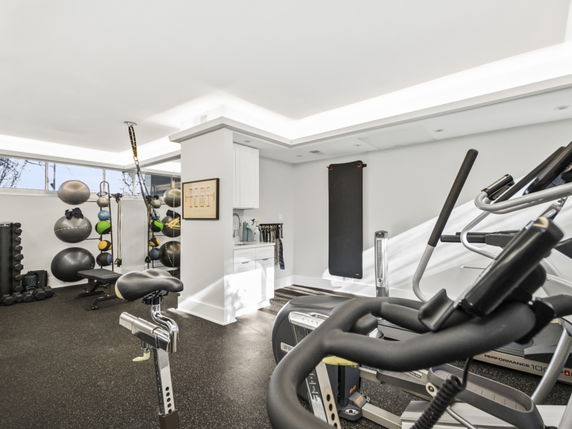 Indoor gym area with exercise equipment and fitness accessories.