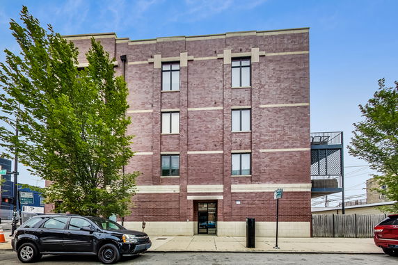 Front view of a four-story brick building.