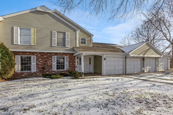 Front view of a two-story house with a double garage.