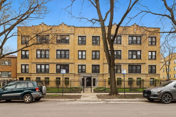 Front view of a four-story apartment building.