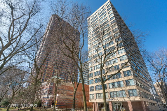 Front view of two high-rise residential buildings.