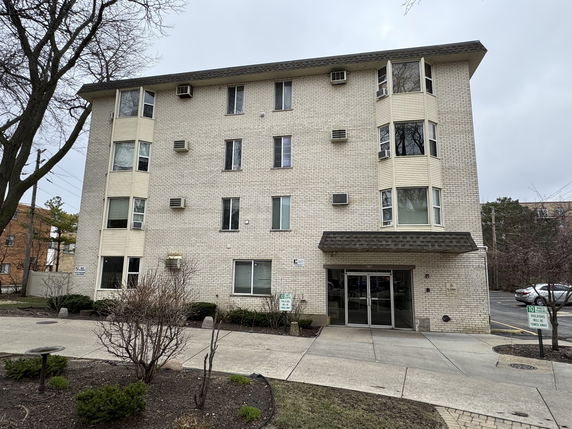 Front view of a multi-story apartment building.