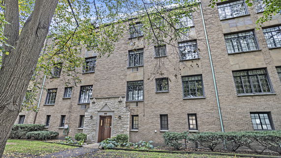 Front view of a multi-story brick building.