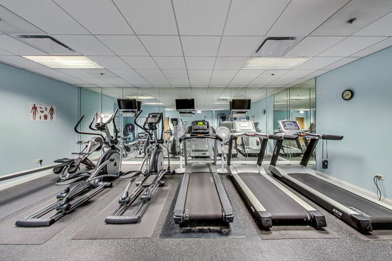 Indoor gym area with treadmills and exercise equipment.