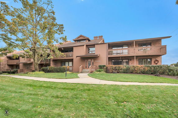 Front view of a two-story residential building with balconies.