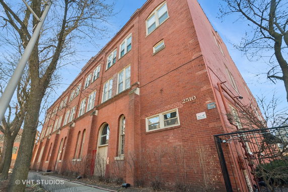 Front view of a multi-story brick building.