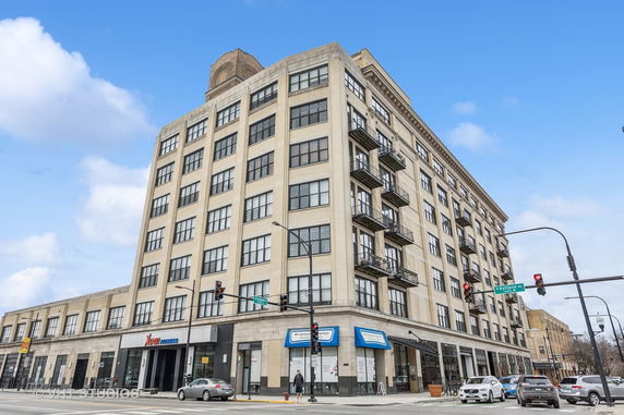 Front view of a multi-story commercial building on a corner lot.