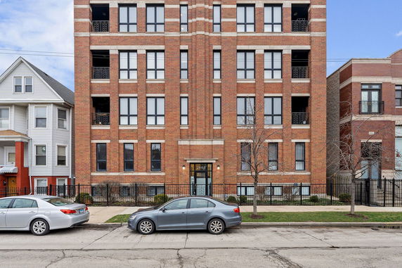 Front view of a multi-story brick building.