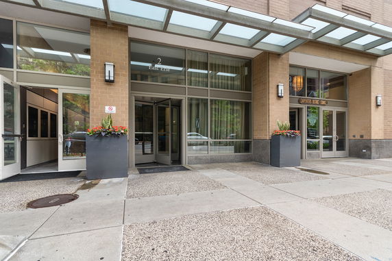 Entrance of a building with glass doors and overhead canopy