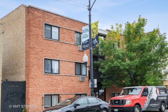 Front view of a three-story brick building.